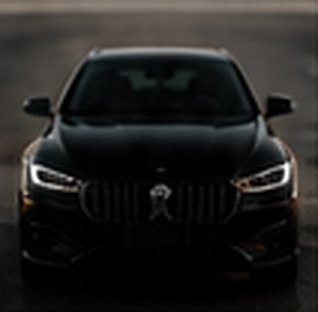 Front of a black car in studio light