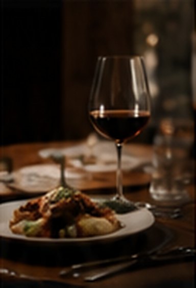 Plated dish and glass of red wine