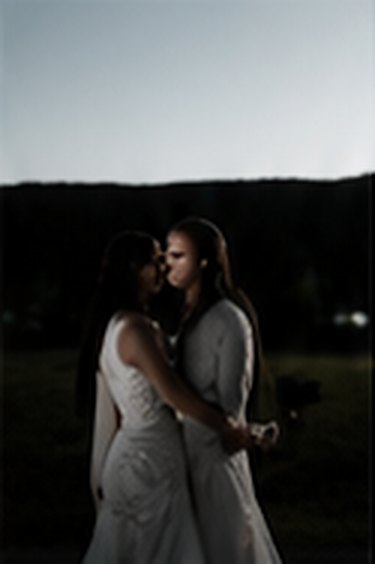 Couple embracing at dusk on their wedding day